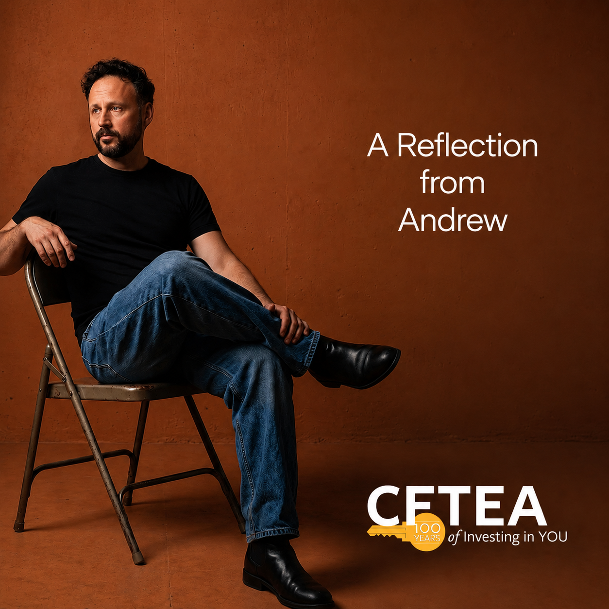 Andrew dressed in a black T shirt, blue jeans, and black boots sits on a folding chair against a warm rust colored backdrop, gazing off to the side in quiet reflection. White text on the right reads, "A Reflection from Andrew." The lower right corner features the CFTEA logo with a gold key celebrating "100 Years" and the tagline, "of Investing in YOU." The wide banner design uses generous open space to create a calm, reflective atmosphere.